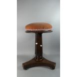 A Late Victorian Circular Topped Piano Stool on Triform Base