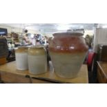 A Copper Saucepan, Oval Cast Iron Cooking Pot, Three Stoneware Jars