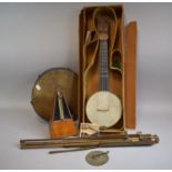 A Vintage Four String Banjo Ukulele in Cardboard Box, A Tambourine, a Music Stand and a Clockwork