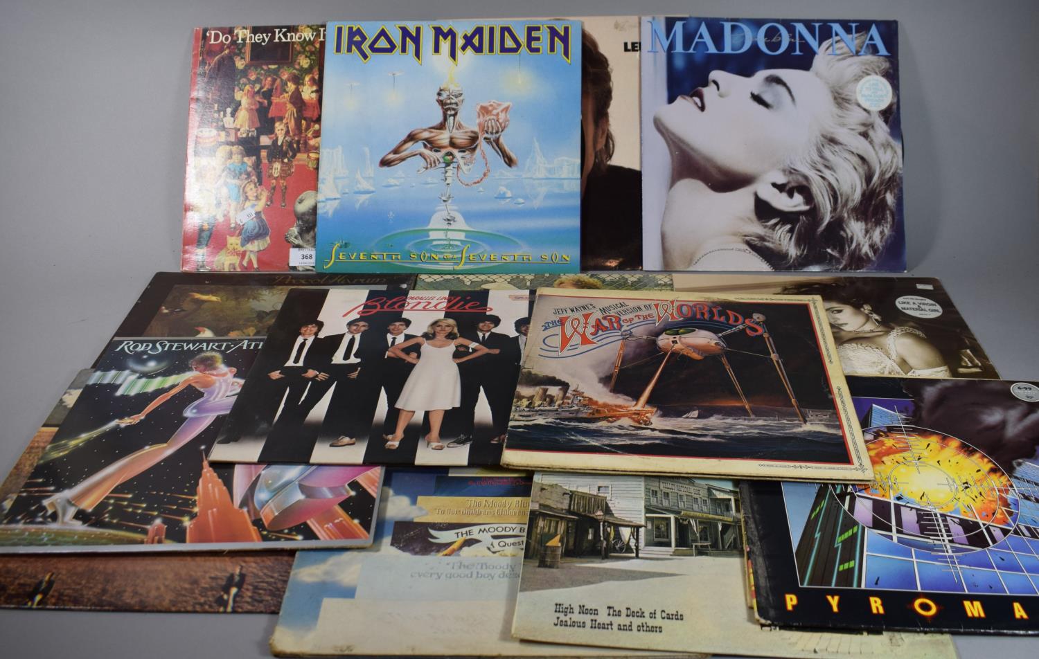 A Collection of 33rpm Records to Include Feed the World, John Lennon, Madonna, Simon and