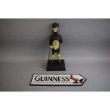 A Cast Metal Reproduction Guinness Figure Together with Sign, 36cms High (Plus VAT)