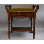 An Edwardian Mahogany Piano Stool With Upholstered Hinged Seat, Turned Carrying Handles and