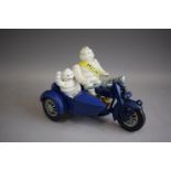A Reproduction Cast Metal Figure of Michelin Men Riding Motorcycle and Sidecar, 22cm Long (Plus VAT)