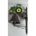 A Cast Metal Wall Hanging Bell with John Deere Tractor Motif, (Plus VAT)