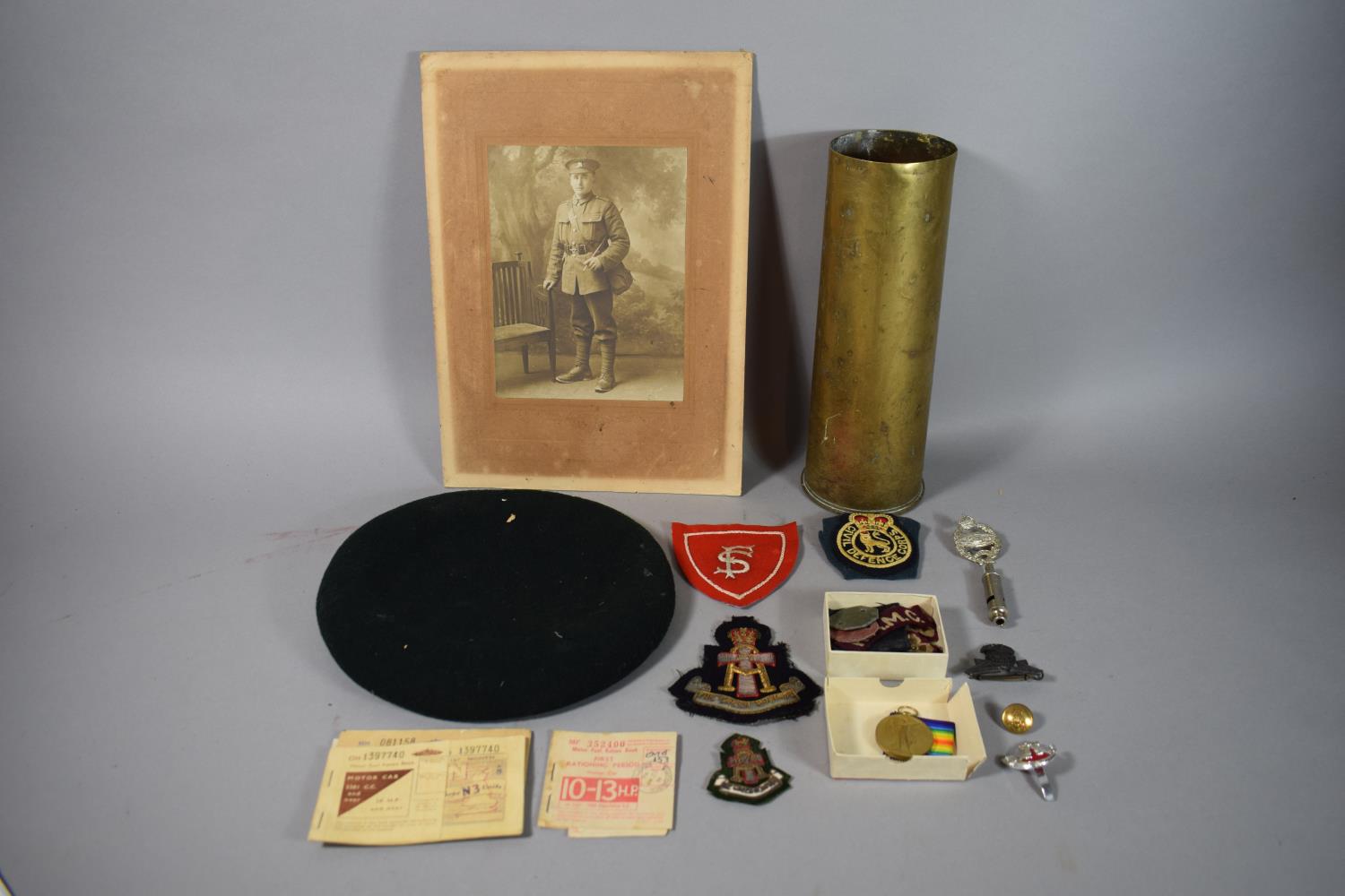 A Collection of Militaria to Include 1942 Shell Case, WWI Photograph and Metal Awarded to 209756 SPR