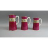A Graduated Set of Three Late 19th Century Jugs with Rope Stylised Handles and Transfer Geometric