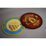 Two Reproduction Cast Metal Manchester United and Manchester City Football Plaques, 24cm Diameter (