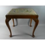 A Tapestry Upholstered Mahogany Framed Stool with Cabriole Supports, 52cm Wide