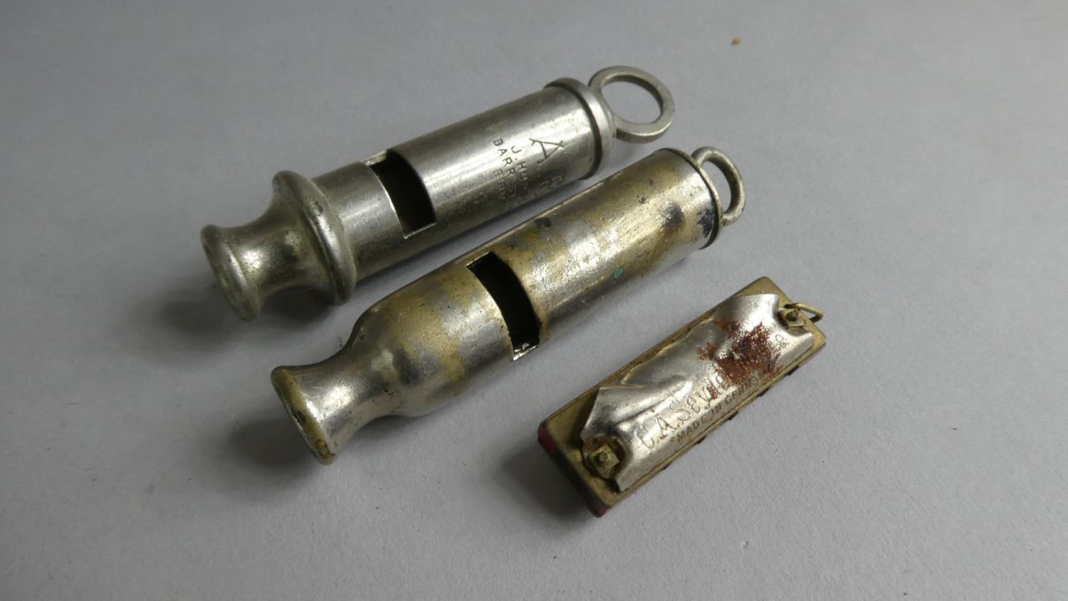 A Hudson ARP WWII Whistle, an Unmarked Example and a German "Little Bandmaster" Miniature Harmonica