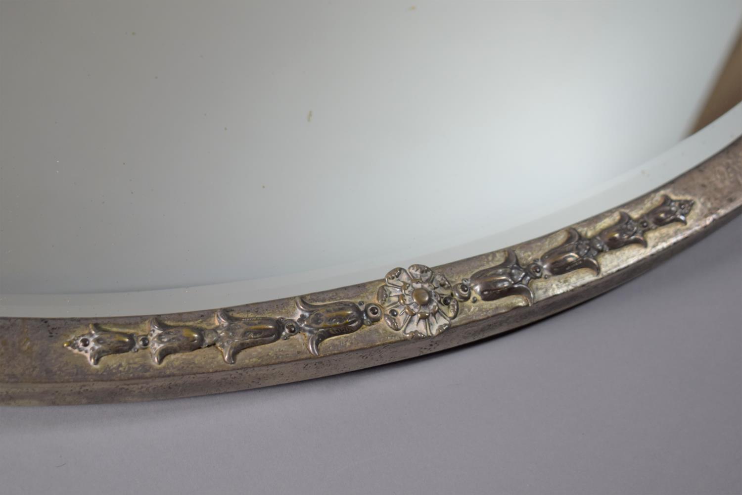 A Late 19th Century Arts and Crafts Influenced Art Nouveau Silver Plate on Brass Framed Oval Wall - Image 2 of 3