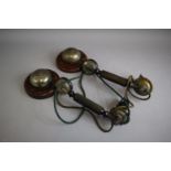 A Pair of Vintage Wall Mounting Bakelite Telephone Hand Sets and Bells on Circular Wooden Wall