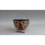 A Continental Ruby Glass Sugar Bowl in Pierced Silver Plated Holder with Loop Carrying Handle, 10.