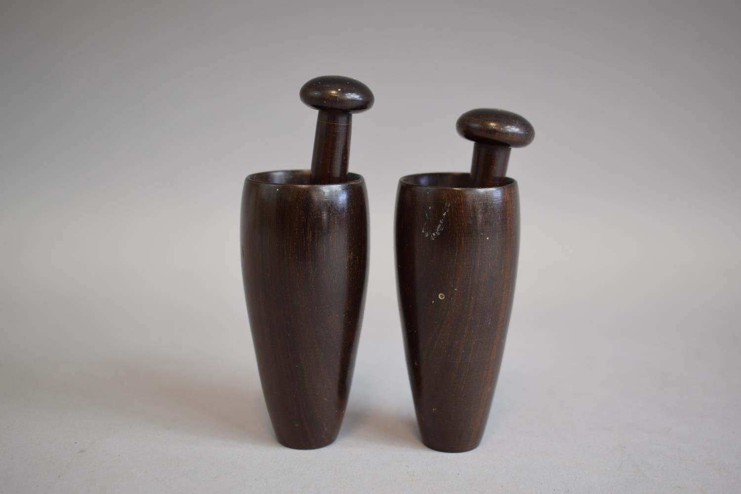 A Pair of Small 19th Century Lignum Vitae Pestles and Mortars. Mortars 8cms, Pointed Pestles with