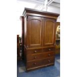 A Victorian Mahogany Linen Press, The Base with Two Short and Two Long Drawers, The Top Section with