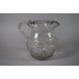 A Late 19th Century Etched and Cut Glass Water Jug Inscribed "Mary Evans, Kedwelly". 16.5cm High