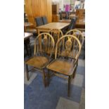 A Set of Four Ercol Hoop Back 'Fleur-de-Lys' Pattern Dining Chairs