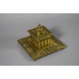 A Brass Square Inkwell with Relief Decoration and Complete with Ceramic Liner. 13cm Square.