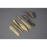 A Collection of Early 20th Century Silver Manicure Tools and Ivory Items Including Bookmark, Reel of