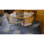 A Chrome Based Octagonal Dining Table and Four Matching Cane Backed Upholstered Chairs