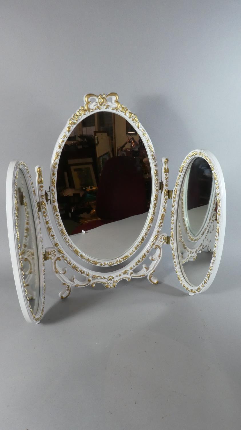 A Mid 20th Century White and Gilt Triple Dressing Table Mirror, 57.5cm High.