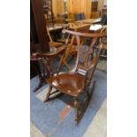 An Interesting Mid 20th Century Mahogany Framed Rocking Chair with Carved Central Detail in the Form