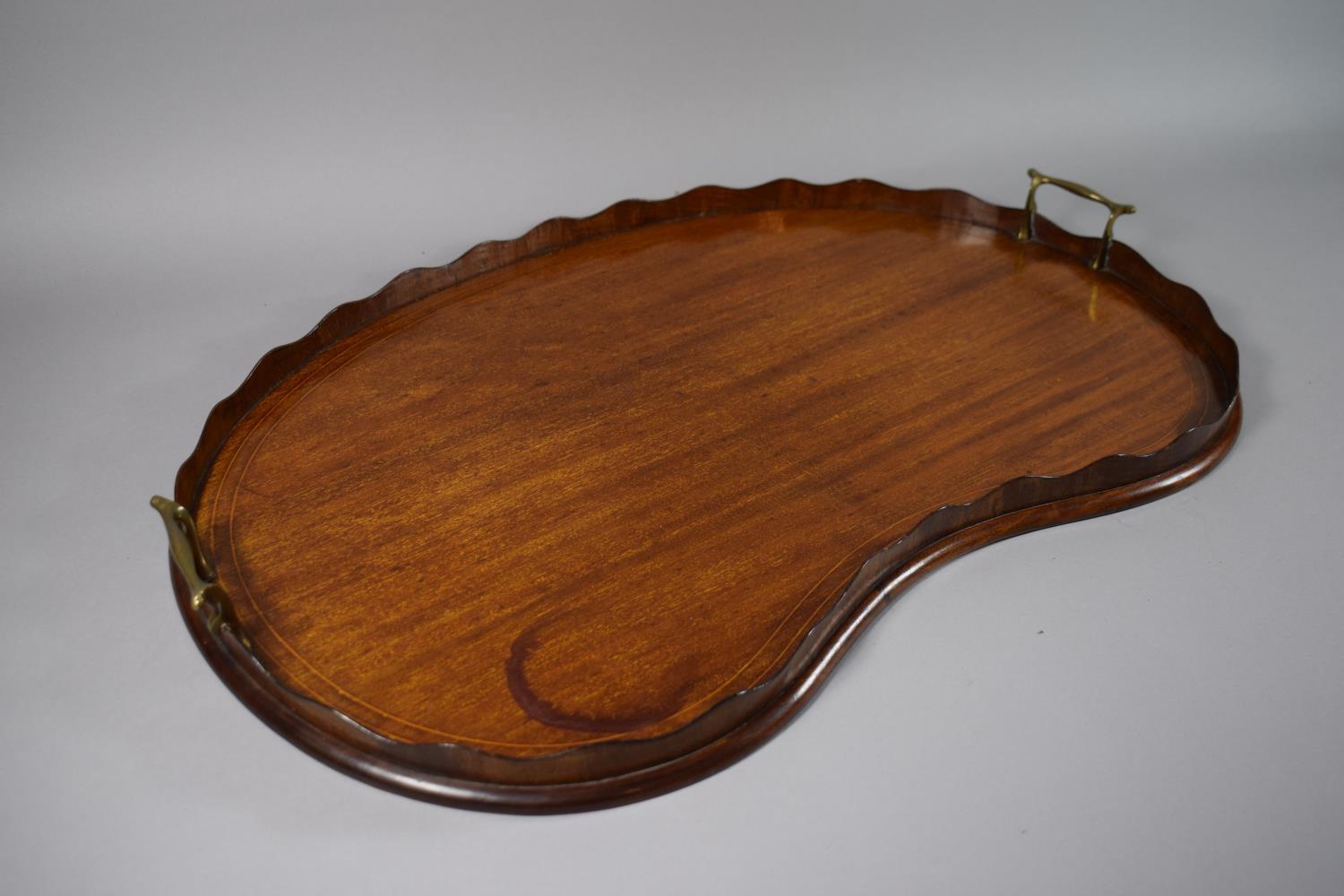 A String Inlaid 19th Century Mahogany Kidney Shaped Gallery Tray with Brass Carrying Handles. 69cm