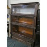 An American Oak Wernicke System Three Section "Elastic" Bookcase with Plinth Base Having Long