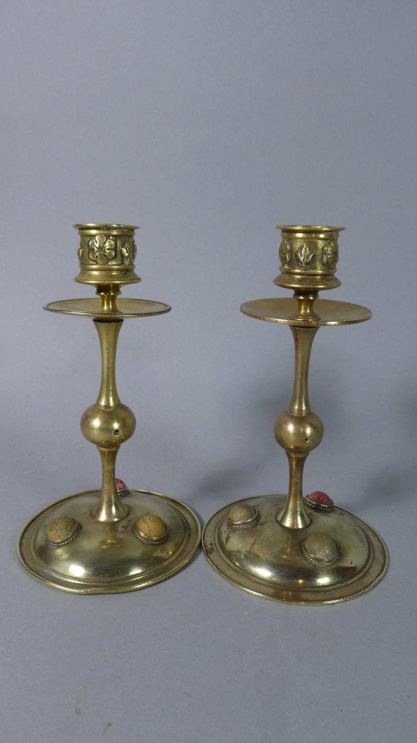 A Pair of Early 20th Century Arts and Crafts Influenced Brass Candlesticks with Stone Cabochons,