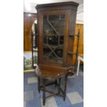 An Unusual Edwardian Carved Oak Astragal Glazed Corner Cabinet with Side Displays on Carved Oak