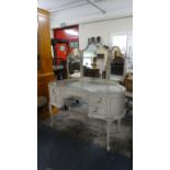 A Cream and Gilt Kidney Shaped Dressing Table Having Centre Drawer Flanked by Two Pairs of Short