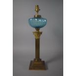 An Early 20th Century Brass Corinthian Column Lamp with Blue Glass Reservoir, 53cm HIgh