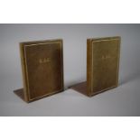 A Pair of R.A.C Leather Mounted Bookends, 14.5cm high