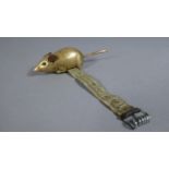 A Late 19th Century/Early 20th Century Novelty Brass Tape Measure in the Form of a Mouse, The Base