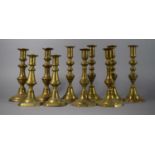 A Collection of Five Pairs of Brass Candlesticks