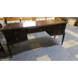 A Stag Mahogany Dressing Table Having Centre Long Drawers Flanked by Two Shorter Drawers Either