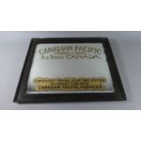 A "Canadian Pacific" Advertising Mirror in Oak Frame Stamped London and North Western Railway. The