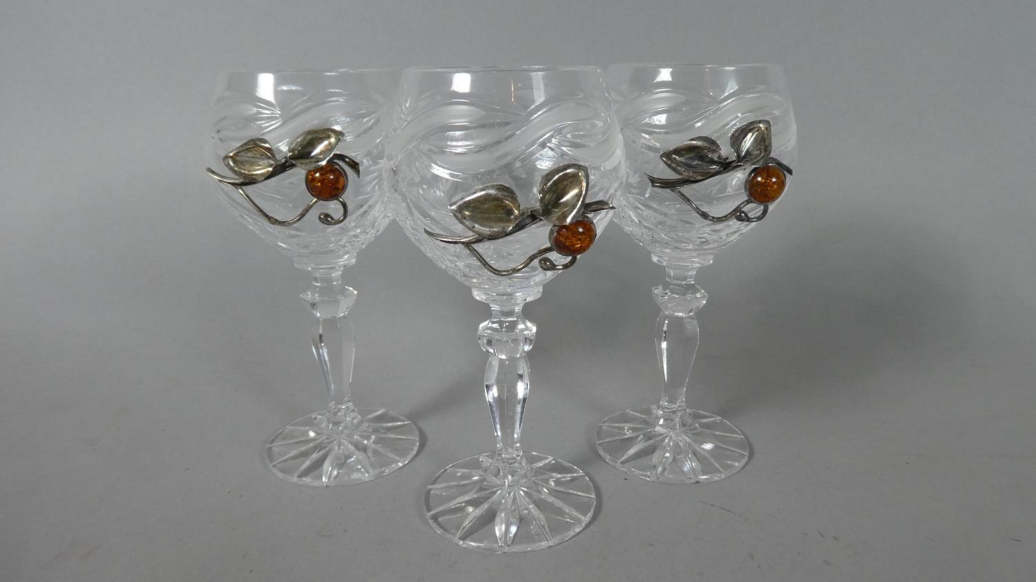 A Set of Three Amber and Silver Mounted Port Glasses