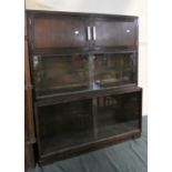 A Mid 20th Century Oak Three Tier Bookcase with Two Graduated Glazed Sections Under Cupboard Top. by