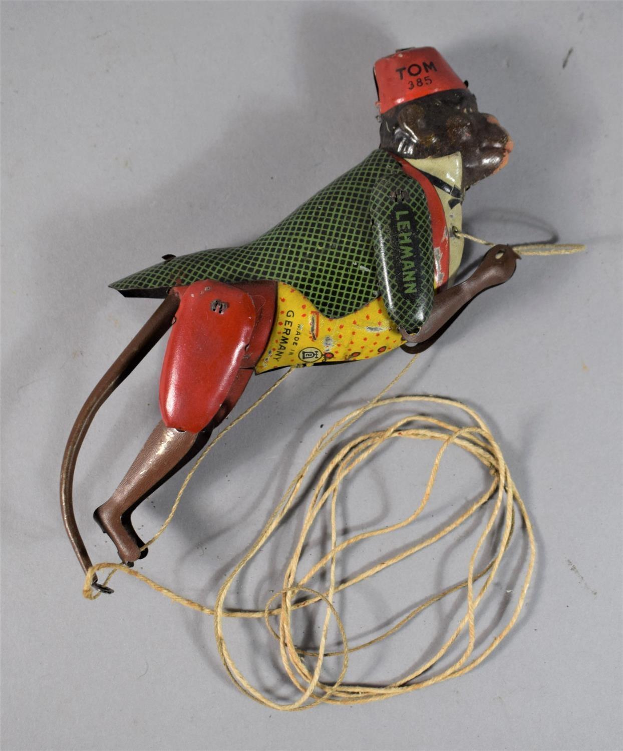 A German Tin Plate Climbing Monkey Toy 'Tom No.385' by Lehmann.