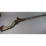 A Mid 19th Century Jezail Flintlock Rifle with Mother of Pearl Inlay and Brass Banding. Flintlock