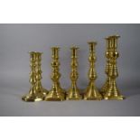 A Collection of Five Pairs of Brass Candle Sticks.