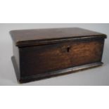 A Late 19th Century/Early 20th Century Stained Oak Savings Box with Coin Slot Containing a