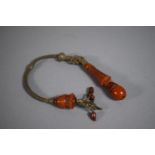 An Amber and Silver Wire Toggle, 22cm Long.