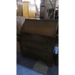 A Mid 20th Century Oak Fall Front Bureau with Three Drawers, 76cm Wide.