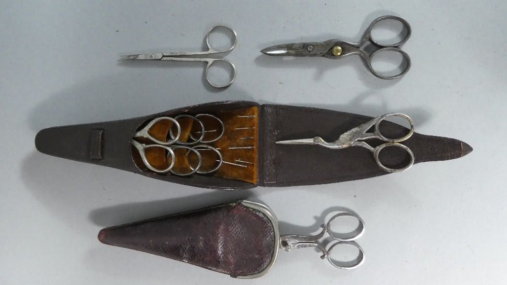 A Collection of Vintage Scissors, A Cased Pair and a Cased Sewing Set.