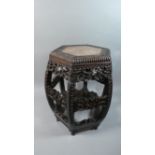 A Chinese Hardwood Vase Stand of Hexagonal Form with Inset Marble Top. Carved, Moulded and Pierced