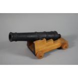A Cast Iron and Wooden Model of a Cannon, 28cm Long.
