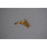 A 9 Carat Gold Charm in the Form of a Harp, 0.6g.