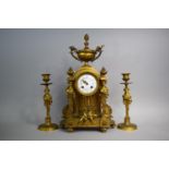 A French Gilt Bronze Clock Garniture in the Second Empire Style having Maiden Supports, Cherub