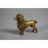 A Vintage Brass Novelty Tape Measure in the Form of a Poodle. 5cm Long.